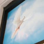a painting of a dove flying